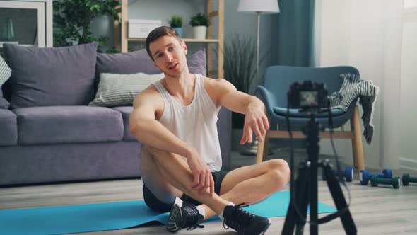 Cheerful Sportsman Is Recording Video for Online Vlog Talking Looking at Camera