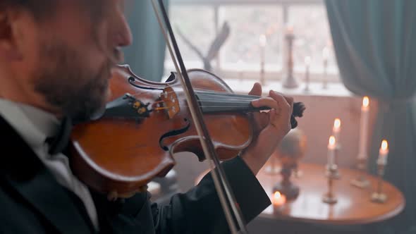 Man Violinist And Candle