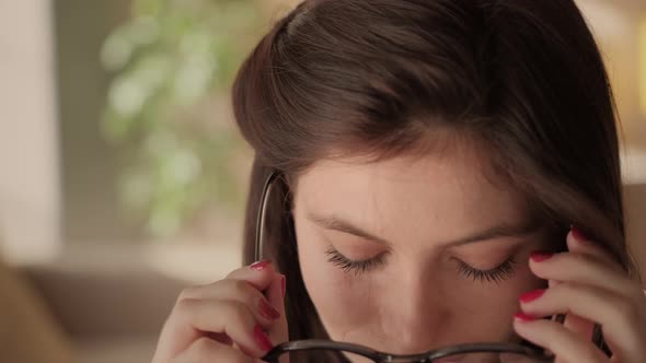 Young, Beautiful Woman Is Reading a Book in a Library. Student and Learning Concept.