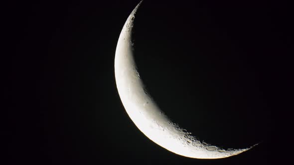 Waning Crescent Moon Moving In Black Sky Background