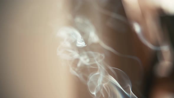 Close Up Shot of an Aromatic Stick Burning with Beautiful White Smoke.