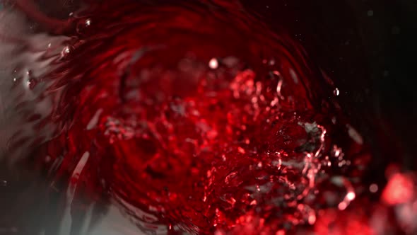 Super Slow Motion Abstract Shot of Red Wine Pouring in Glass Bottle at 1000 Fps.