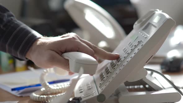 The Analog Phone - Close-up View. The Sales Manager Dials the Customer's Number