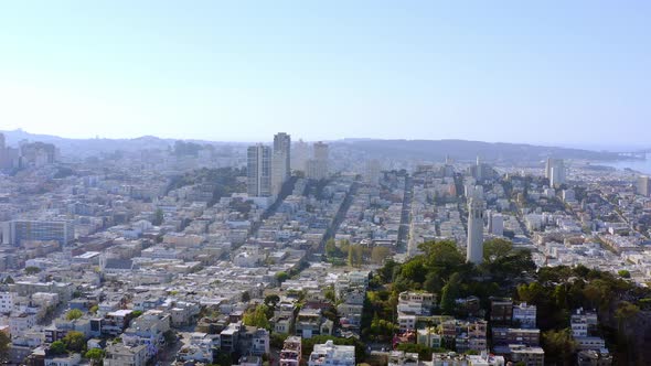 Aerial: San Francisco cityscape and Coit Tower, drone view