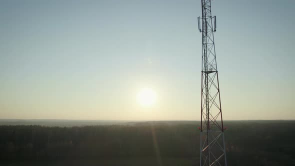 Communication Tower on the Background of the Sky with the Sunset