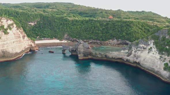 Aerial View of the Green Tropical Coast of the Island of Nusa Penida, Atuh Beach, Bali, Indonesia