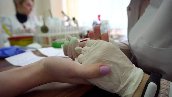 Closeup View of Blood Analysis From Finger