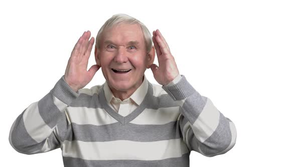 Cheerful Pensioner Watching Football.