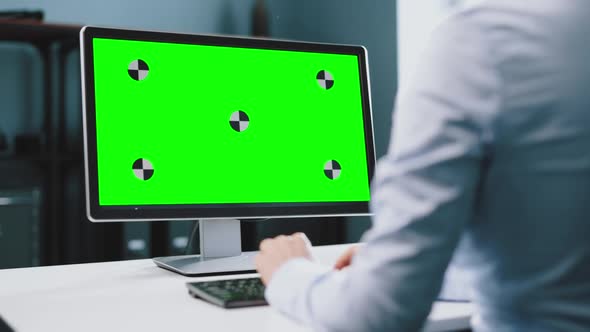 Woman Working on Computer with Chroma Key Screen