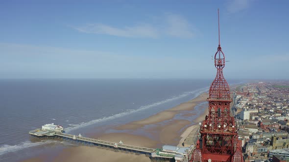 Aerial footage, drone view , of the famous Blackpool Tower and beach from the sky on a beautiful Sum