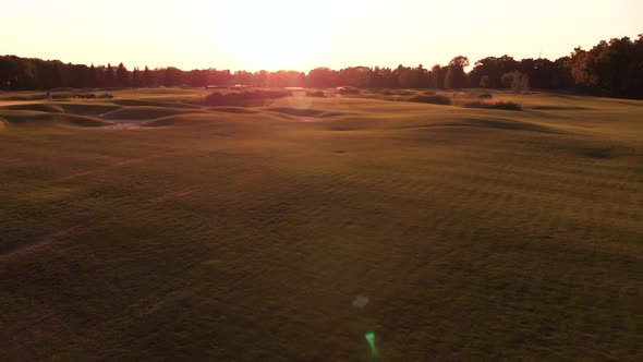 Sunset Shine and Bumpy Grass Field