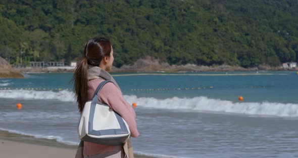 Woman look at the sea at winter time