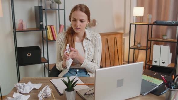 Sad Young Woman Working at Home Office Crumples Throwing Heets of Paper with Bad Ideas and Mistakes