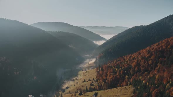 Winding Dense Mist Strip Between High Hills with Meadows