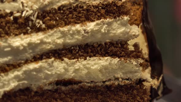 Closeup on a Slice of a Chocolate-and-cream Cake on a Baking Sheet