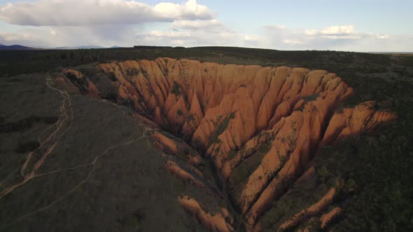 Drone Flight over Cárcavas desert limestone sand rocks formation at sunset, Spain.