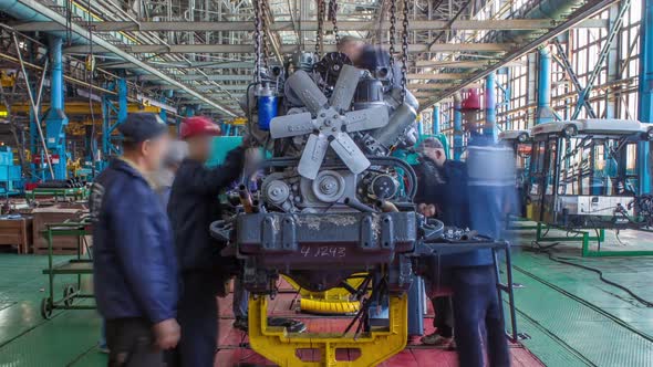 Conveyor Assembly Stage the Body of Tractor at Big Industrial Factory Timelapse