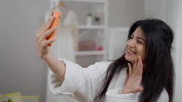 Happy Cheerful Young Bride Bragging Engagement Ring Showing Finger at Video Chat on Smartphone