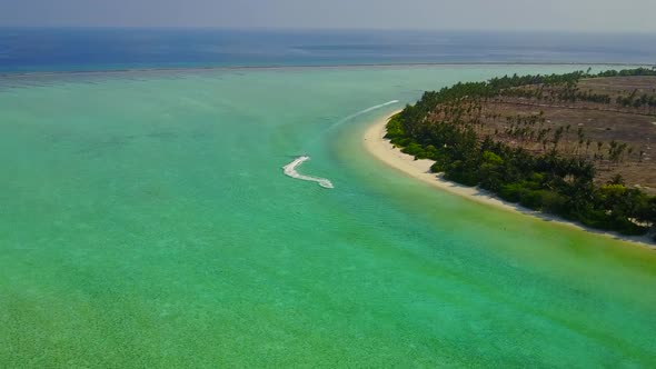 Aerial drone scenery of resort beach voyage by water with sand background