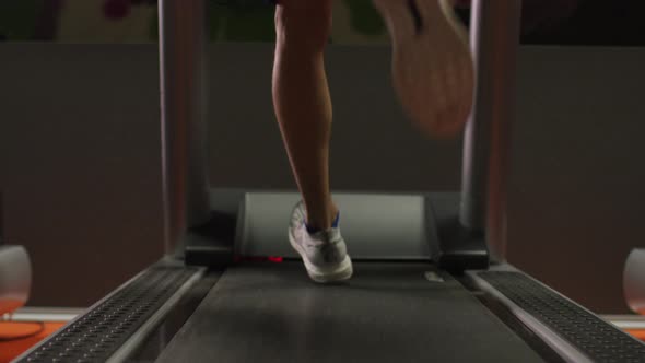 Close up of legs running on treadmill