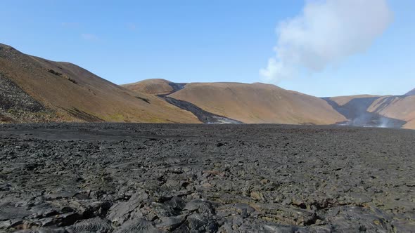 Flying low over the lava from erupting volcano, Natthagi valley, Iceland