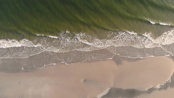 Aerial view overlooking a calm water at a Ostende Beach, on Langeoog island