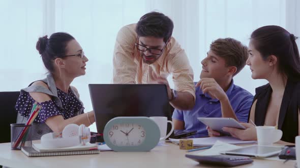 Group Meeting of Creative Business People Designer and Artist at Office Desk