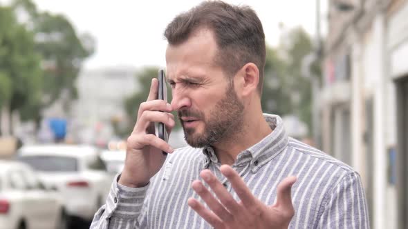 Angry Beard Casual Man Talking on Phone