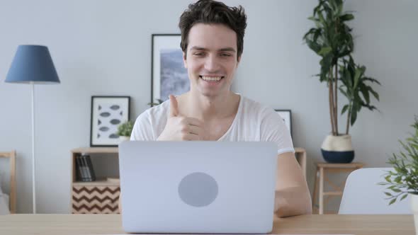 Man Busy in Online Video Chat on Laptop at Work