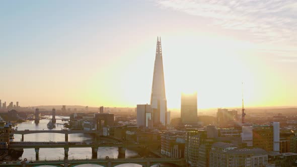 Aerial slider drone shot of the sunrise behind the Shard London