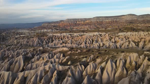 Cappadocia Aerial Drone or Balloon View to Red and Rose Valley Rock Formation Ancient Cave Churches