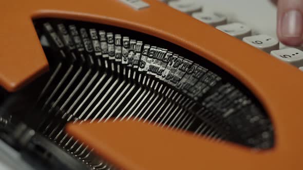 Human Hands Typing on Retro Typewriter Closeup Fingers Pressing Buttons of Oldfashioned Typewriter