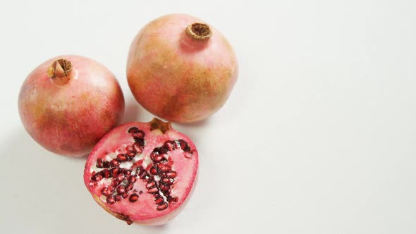 Pomegranate with half piece on white background 4K 4k