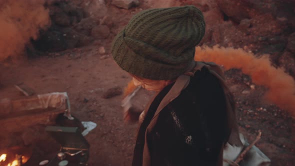 Woman Dancing with Smoke Bomb in Dystopian World