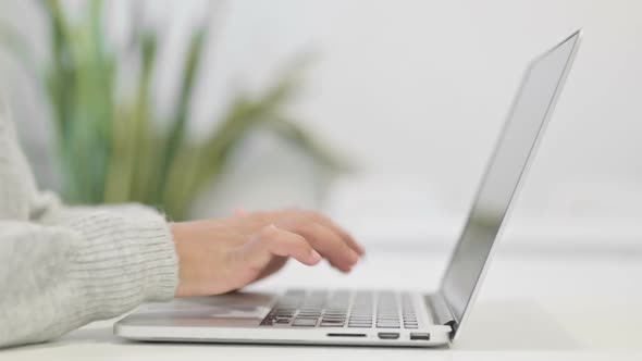 Close Up of Hands of African Woman Working on Laptop