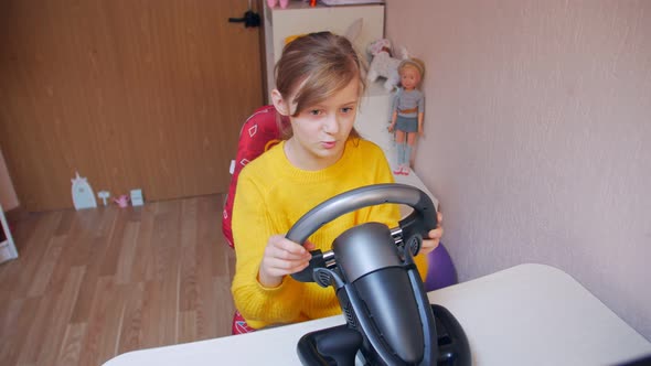 Girl Playing On The Gaming Wheel