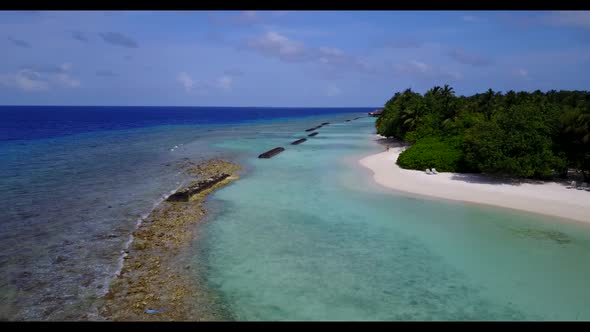 Aerial view landscape of marine island beach wildlife by blue green ocean with clean sandy backgroun