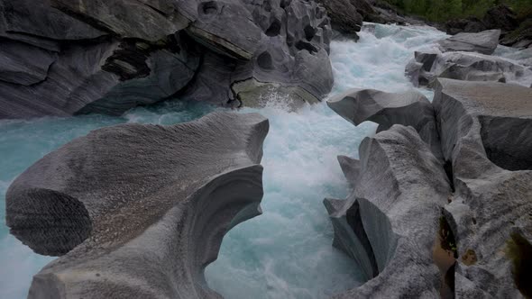 White river rapids along the rocks of the Marble Castle in Northern Norway -Wide