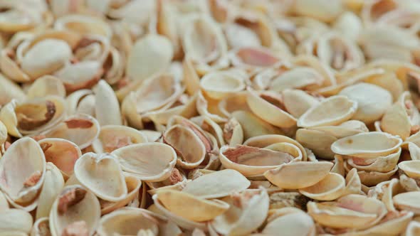 Looped Rotating Empty Pistachios Shells Full Frame Closeup Background