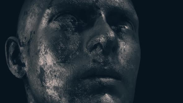 Metallic Grungy Sculpted Man Face In Dark Background