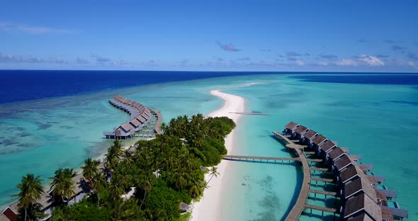 Luxury above abstract shot of a paradise sunny white sand beach and aqua blue water background in hi