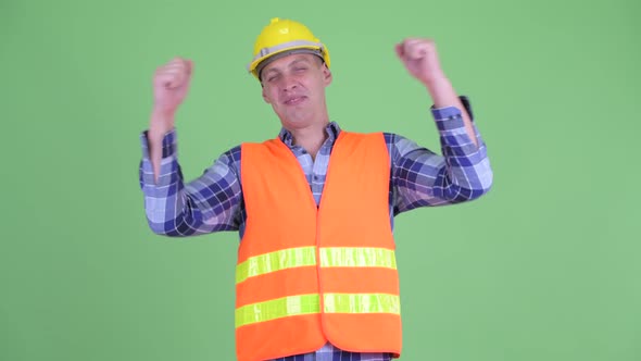 Happy Young Man Construction Worker Getting Good News