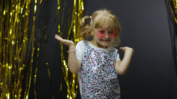 Stylish Child Dancing, Make Faces, Waving Hand in Silly Dance. Little Blonde Kid Girl 4-5 Years Old