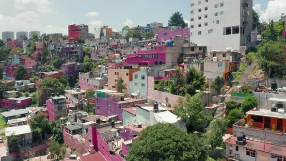 Drone Flying Above the Vibrant Slum District, Aerial Pink Favelas in Mexico  alt