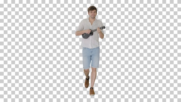 Young man playing ukulele while walking, Alpha Channel
