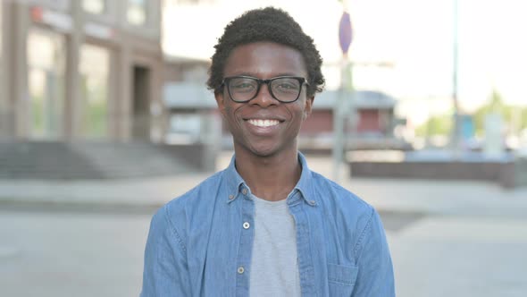 Agree Young African Man Shaking Head in Approval Outdoor