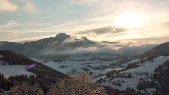 Mountain Winter Landscape the Sun Shines Through the Clouds the Clouds Spill Over the Hills