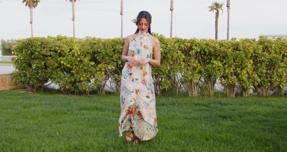 Model with long white dress with flowers