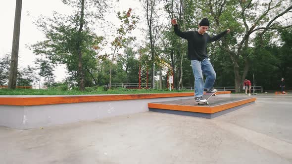 Skateboarder in Skate Park Doing Tricks Slow Motion