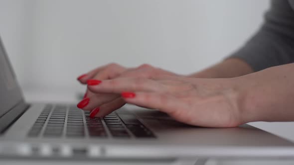 Female Fingers Pressing a Keys on Contemporary Laptop